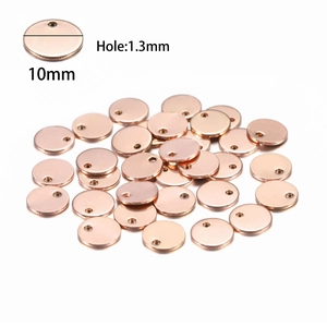 Detail of 10mm rose gold stainless steel round charm with 1.3mm hole for DIY jewelry