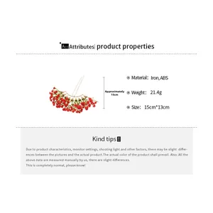 Detail showing red flower hair pin with iron and ABS material specifications and dimensions