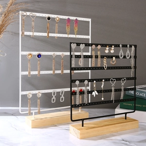 Multi-tier metal jewelry display stand with wooden base for earrings and studs