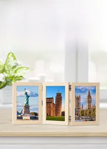 Detail of modern triple folding wood picture frame with sturdy metal hinges and natural finish