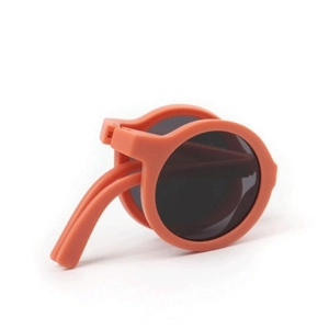 Foldable orange round frame kids sunglasses with dark grey lenses and matte finish