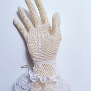 Detail of beige mesh lolita glove with white lace trim and floral embroidery accents