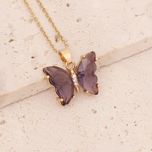 Elegant gold butterfly necklace with purple wings and sparkling crystal stones