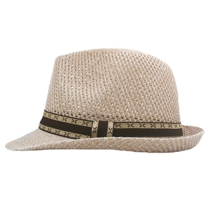Detail of beige knitted straw fedora hat with breathable hollow mesh and patterned brown band