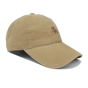 Detail of khaki cotton baseball cap showing SN letter embroidery and curved brim