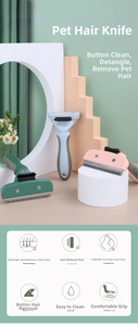 Detail of ergonomic pet de-shedding tool with stainless steel teeth and one-click clean button
