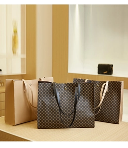 Detailed shot of large tote bags with classic geometric patterns and sturdy handles