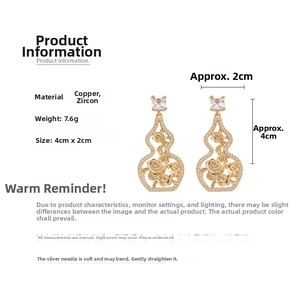 Detail view of hollow gourd earrings with zircon inlay showing 4cm by 2cm dimensions