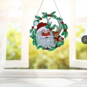 Detail of DIY Christmas diamond painting wreath with Santa, reindeer and metal chain