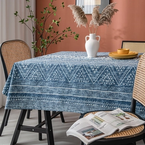 Blue geometric pattern cotton linen tablecloth on dining table with rustic home decor