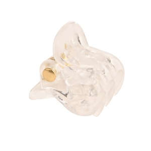 Macro view of a clear acrylic hair claw clip with wave design and golden metal pin