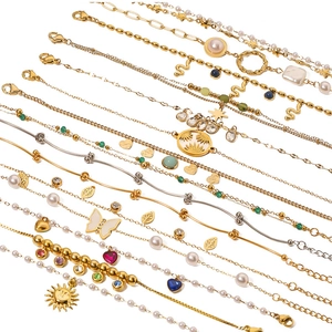 Collection of bohemian gold and silver bracelets with pearls, zircons and butterfly pendants