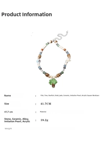 Detail view of colorful beaded necklace with ceramic tree pendant and length measurement