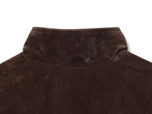 Detailed view of the dark brown suede fabric and stitching on the collar of a bomber jacket