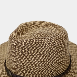 Close-up of woven straw fedora featuring two-tone texture and vintage metal buckle