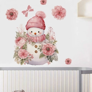 Detail of watercolor snowman wall sticker with pink knit hat and floral accents in nursery