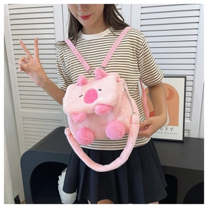 Pink plush cartoon animal bag with adjustable straps shown on a model