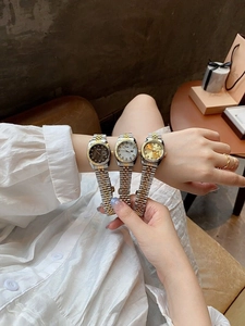 Three ladies waterproof watches with fluted bezel and steel date display dials