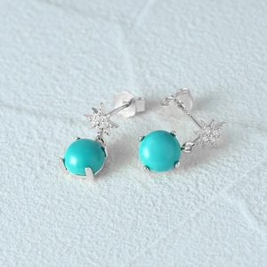 Detailed close-up of S925 silver star earrings with turquoise stone and zircon accents