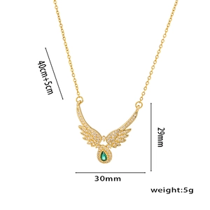 Gold angel wing necklace with green teardrop stone and detailed dimension markings