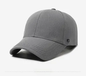 Detail view of dark grey baseball cap showing twill fabric and side logo tag