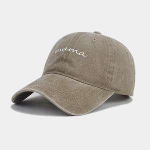 Detailed shot of vintage washed khaki cotton baseball cap with embroidered mama script
