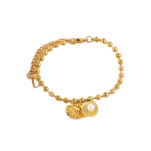 Gold beaded chain bracelet featuring hollow seashell charm with a white pearl accent
