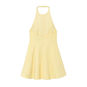 Detail of yellow halter neck dress showing backless design and zipper closure