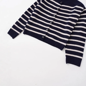 Women's crew neck striped knit cardigan with navy blue stripes and black button closure