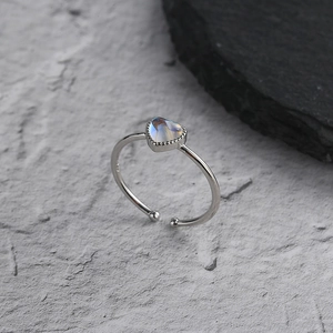 Close-up of S925 sterling silver ring featuring a heart-shaped blue moonstone detail