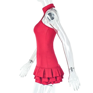 Detail view of red tiered ruffle dress with sleeveless halter neck design on mannequin