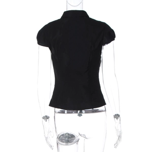 Rear view of black slim-fit button-up shirt showing collar detail and tailored cut