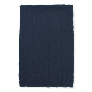 Close-up of navy blue rectangular scarf fabric showing rich crushed texture and cotton linen material
