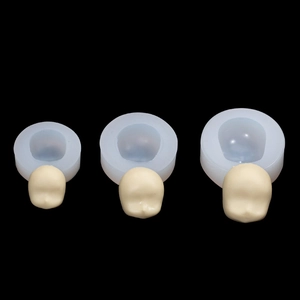 Three sizes of silicone face molds for clay dolls showing small to large scale comparison