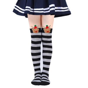 Close-up of kids Christmas over-knee socks with reindeer 3D plush doll detail