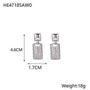 Detailed view of silver rectangular leaf earrings with textured finish measuring 4.6cm by 1.7cm