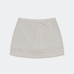Detail of light gray pleated mini skirt with star logo and elastic athletic fabric