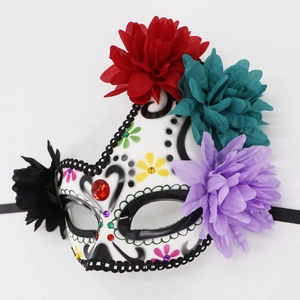 Detail of Day of the Dead mask with colorful flowers, rhinestones and sequins