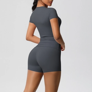 Close-up of deep grey high-stretch yoga set featuring seamless knit texture and racerback