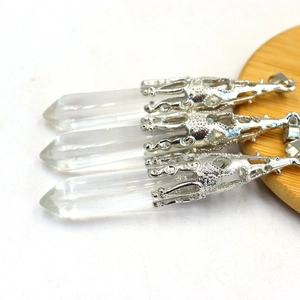 Macro detail of hexagonal amethyst pendants with silver crown-shaped metal bases