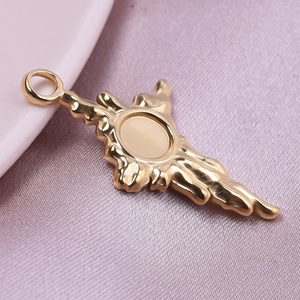 Golden 304 stainless steel pendant accessory for DIY jewelry making on pink silk fabric