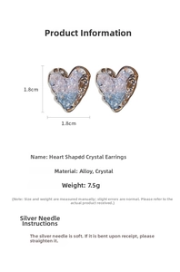 Detailed size view of silver heart earrings with blue crystals, 1.8cm x 1.8cm dimensions