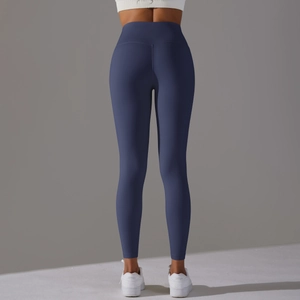 Rear view of high-waisted navy yoga leggings showing elastic fit and butt-lifting seam