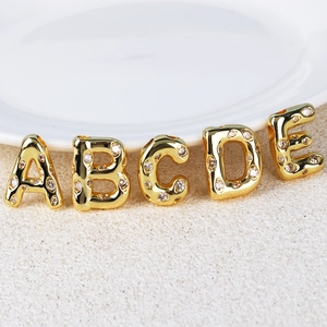 Hip hop style gold plated A-E letter pendants with white zircon stones on textured surface