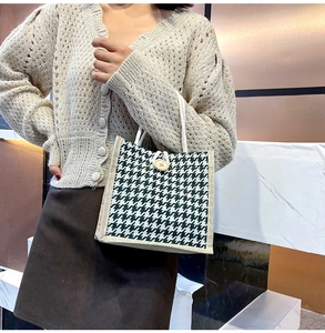 Detail of green houndstooth canvas tote bag with wooden button and cotton rope handle