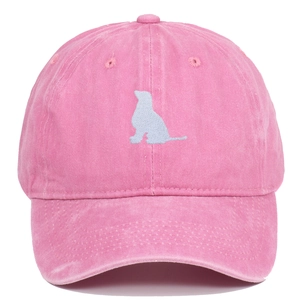 Pink washed cotton baseball cap featuring blue sitting dog silhouette embroidery on front
