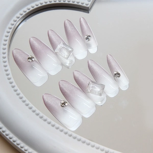 Cat eye press-on nails with purple gradient design and sparkling diamond accents