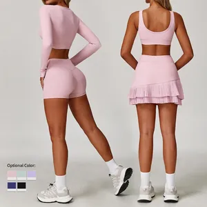 Pink athletic yoga set with long sleeve crop top and pleated tennis skirt outfit