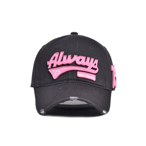 Close-up of distressed brim and pink 3D embroidery on black vintage baseball cap