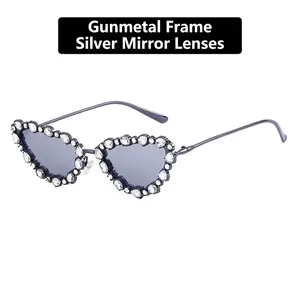 Detail of gunmetal heart-shaped sunglasses with sparkling rhinestones and white mirror lenses